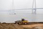 A bulldozer works for an ecological remediation project at a water conservation area of Yujiatou waterworks in Wuhan, capital of central China's Hubei Province, Dec. 27, 2017. China's annual political sessions of the National People's Congress (NPC) and the National Committee of the Chinese People's Political Consultative Conference (CPPCC) are scheduled to convene in March, 2018. During the two sessions, development agendas will be reviewed and discussed, and key policies will be adopted. Year 2018 marks the first year of fully implementing the spirit of the 19th National Congress of the Communist Party of China, which vowed to pursue the vision of innovative, coordinated, green, and open development that is for everyone. The CPC congress stressed that building an ecological civilization is vital to sustain the Chinese nation's development, 